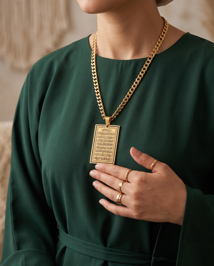 Ayatul Kursi pendant necklace worn with an emerald dress