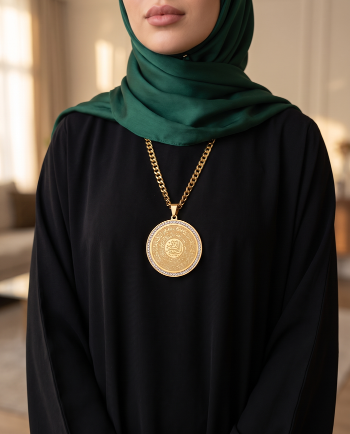 Crystal halo Quran medallion necklace worn with an abaya